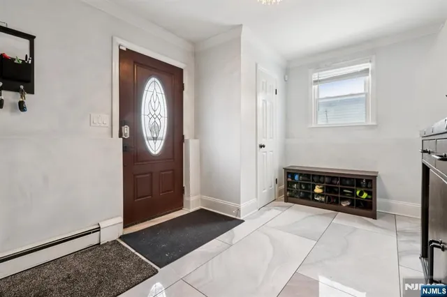 a bedroom with a bed and a mirror