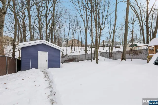 a view of a backyard of the house