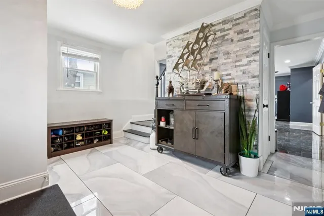 a room with fireplace and chandelier