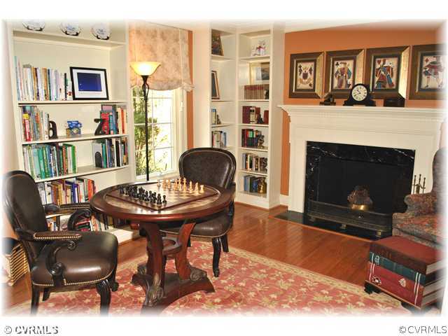 2821 West Brigstock Road Midlothian, VA 23113 - Photo 2 of 12 a living room with furniture and a fireplace