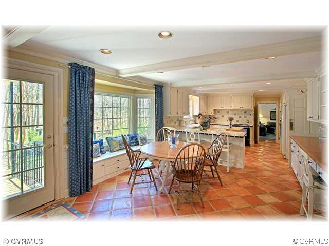 2821 West Brigstock Road Midlothian, VA 23113 - Photo 5 of 12 a dining room with furniture a rug and a large window