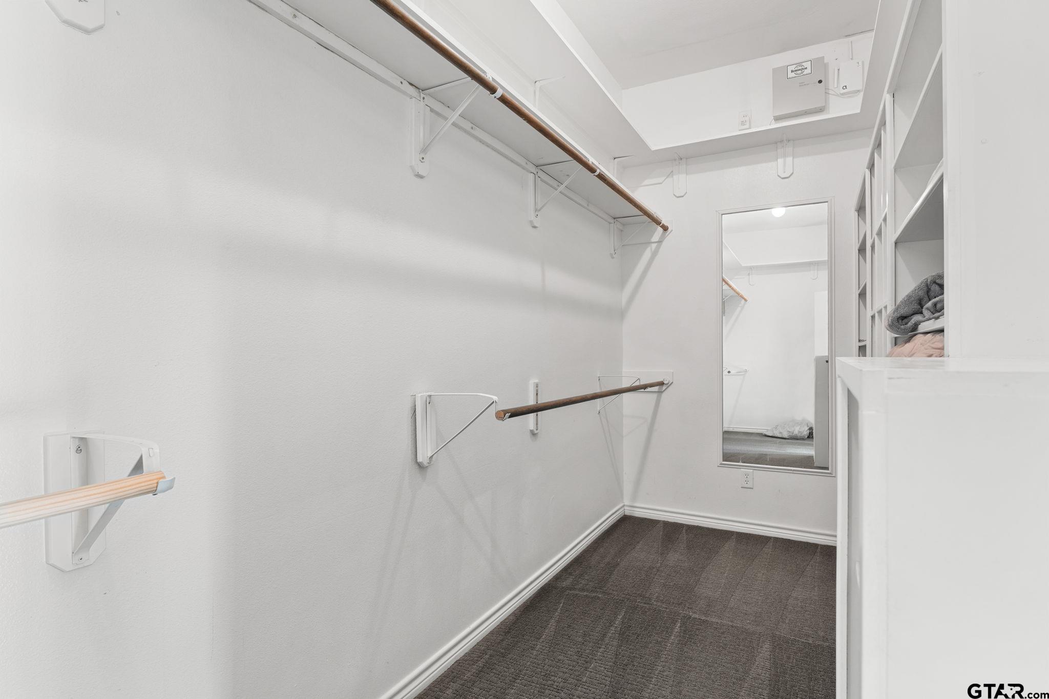 7031 Ridge Pl Circle Tyler, TX 75703 - Photo 14 of 27 a view of an empty walk in closet