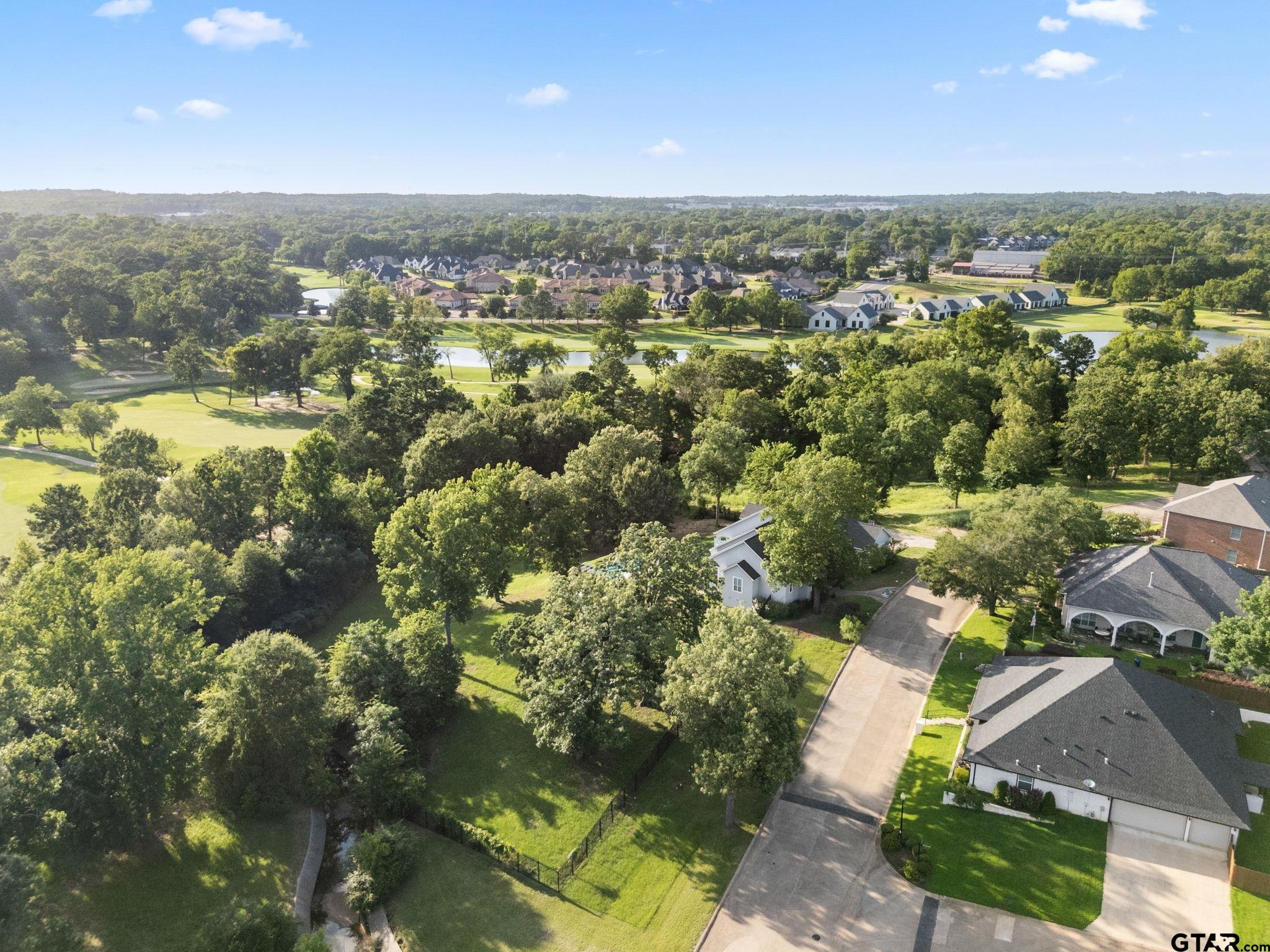7031 Ridge Pl Circle Tyler, TX 75703 - Photo 3 of 27 an aerial view of residential houses with outdoor space and swimming pool