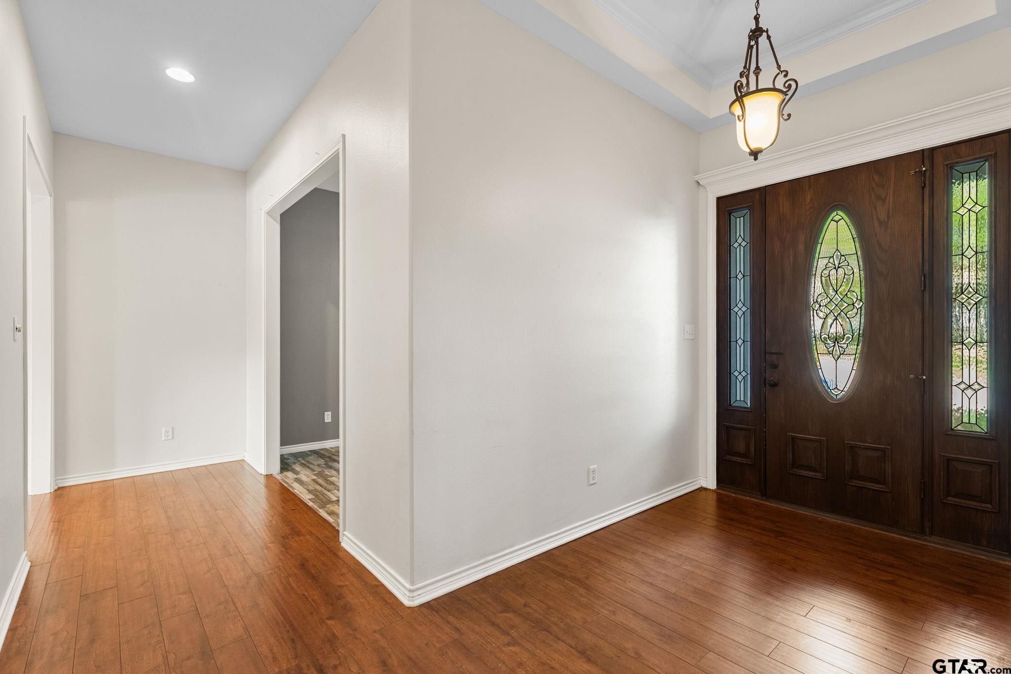 7031 Ridge Pl Circle Tyler, TX 75703 - Photo 4 of 27 wooden floor in an empty room with a window