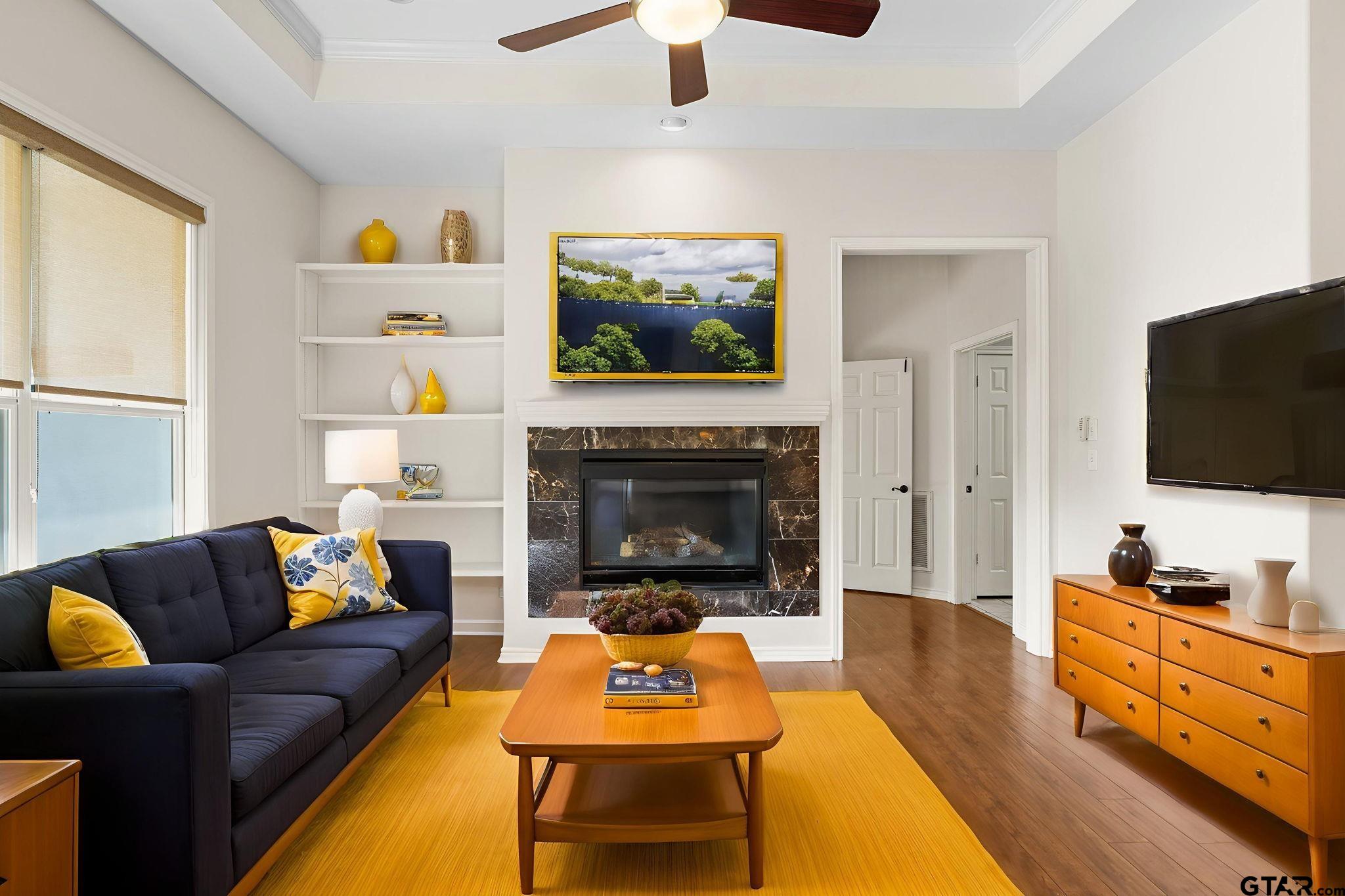 7031 Ridge Pl Circle Tyler, TX 75703 - Photo 10 of 27 a living room with furniture and a flat screen tv