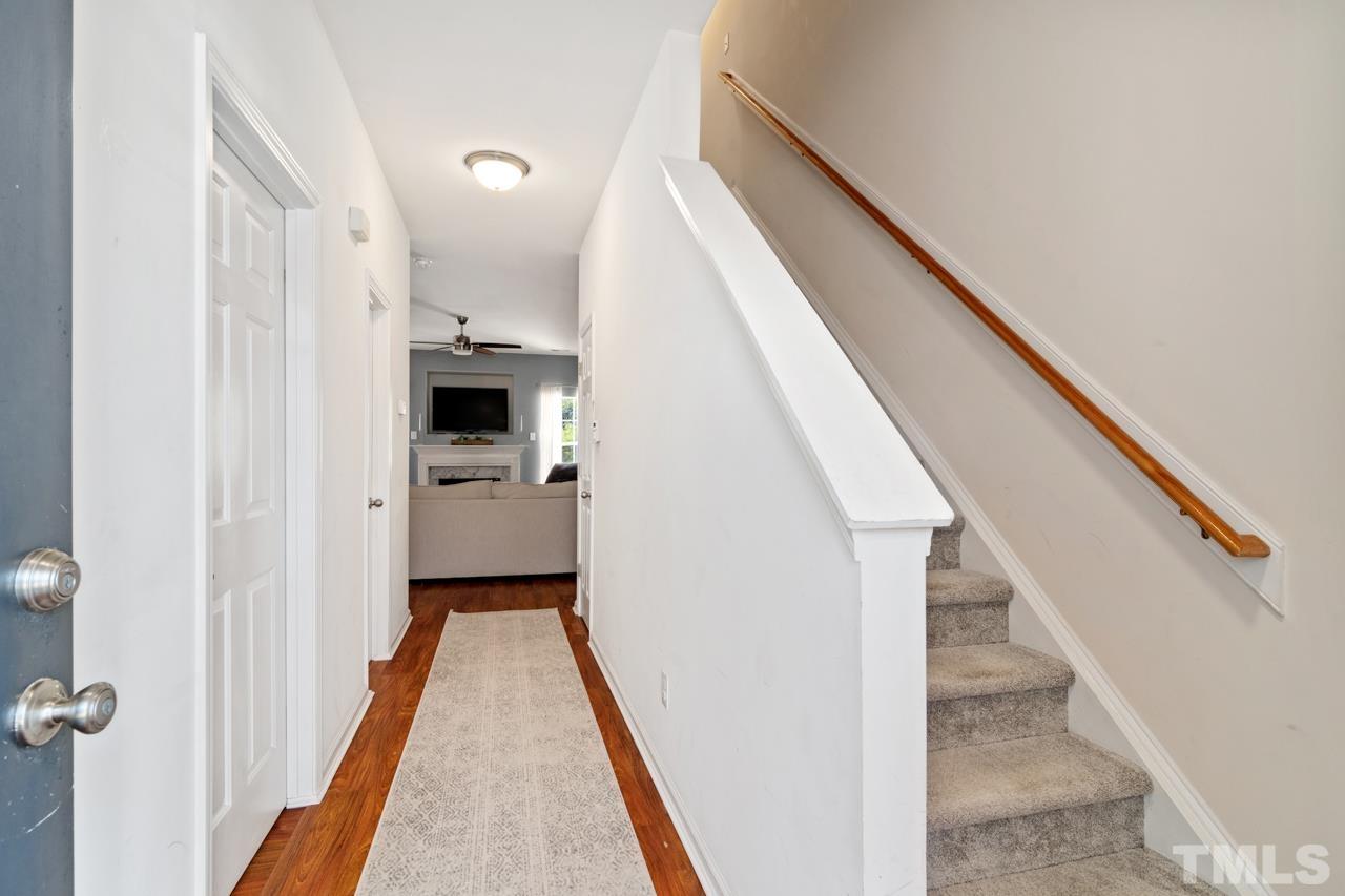 32 Brafferton Court Durham, NC 27713 - Photo 11 of 32 a view of a hallway with white stainless steel appliances