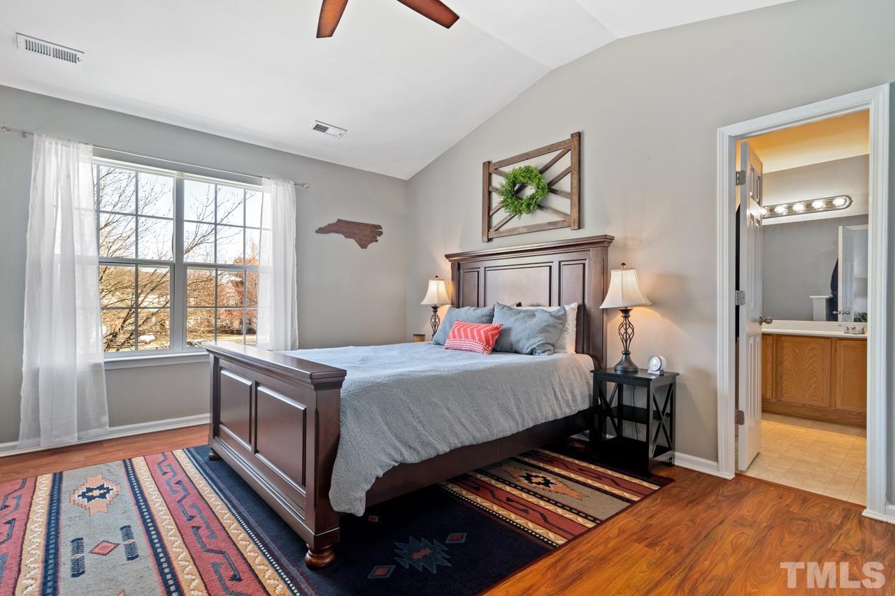 32 Brafferton Court Durham, NC 27713 - Photo 14 of 32 a bed room with a bed and a window