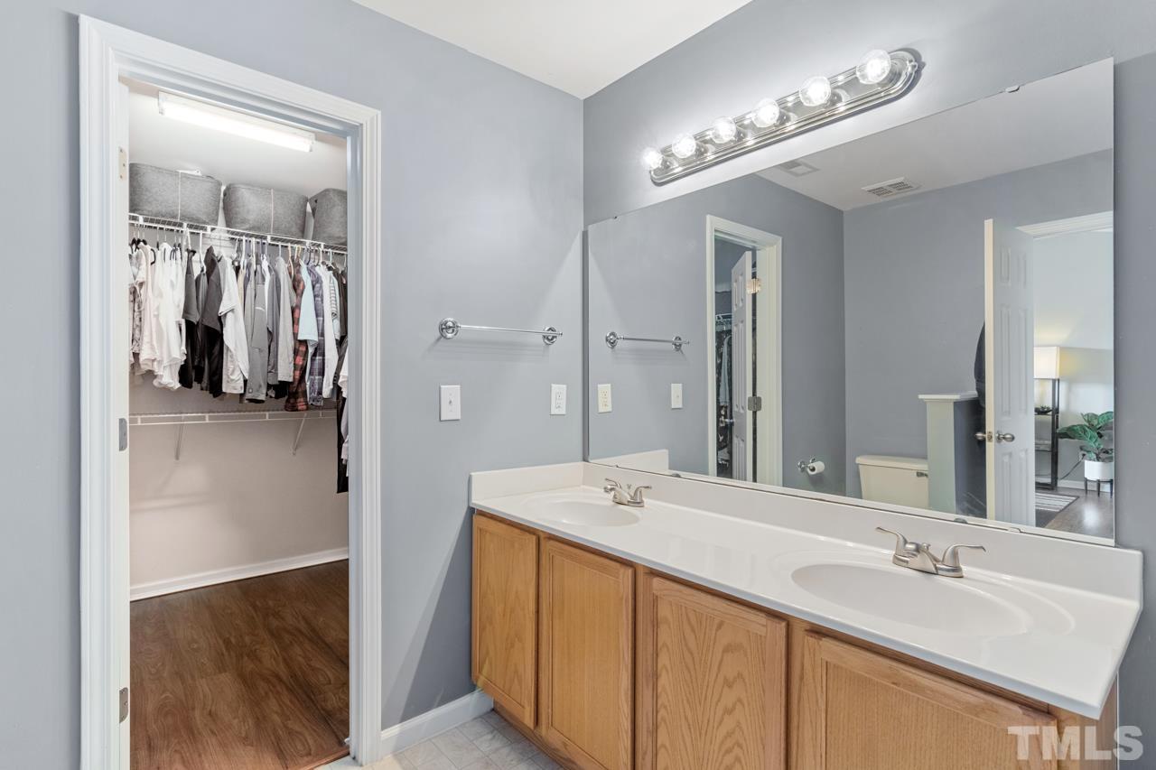 32 Brafferton Court Durham, NC 27713 - Photo 15 of 32 a en suite bathroom with a sink double vanity and a mirror