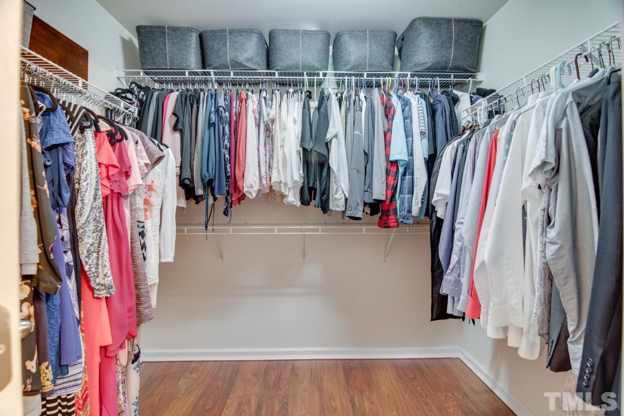 32 Brafferton Court Durham, NC 27713 - Photo 16 of 32 a view of walk in closet with clothes