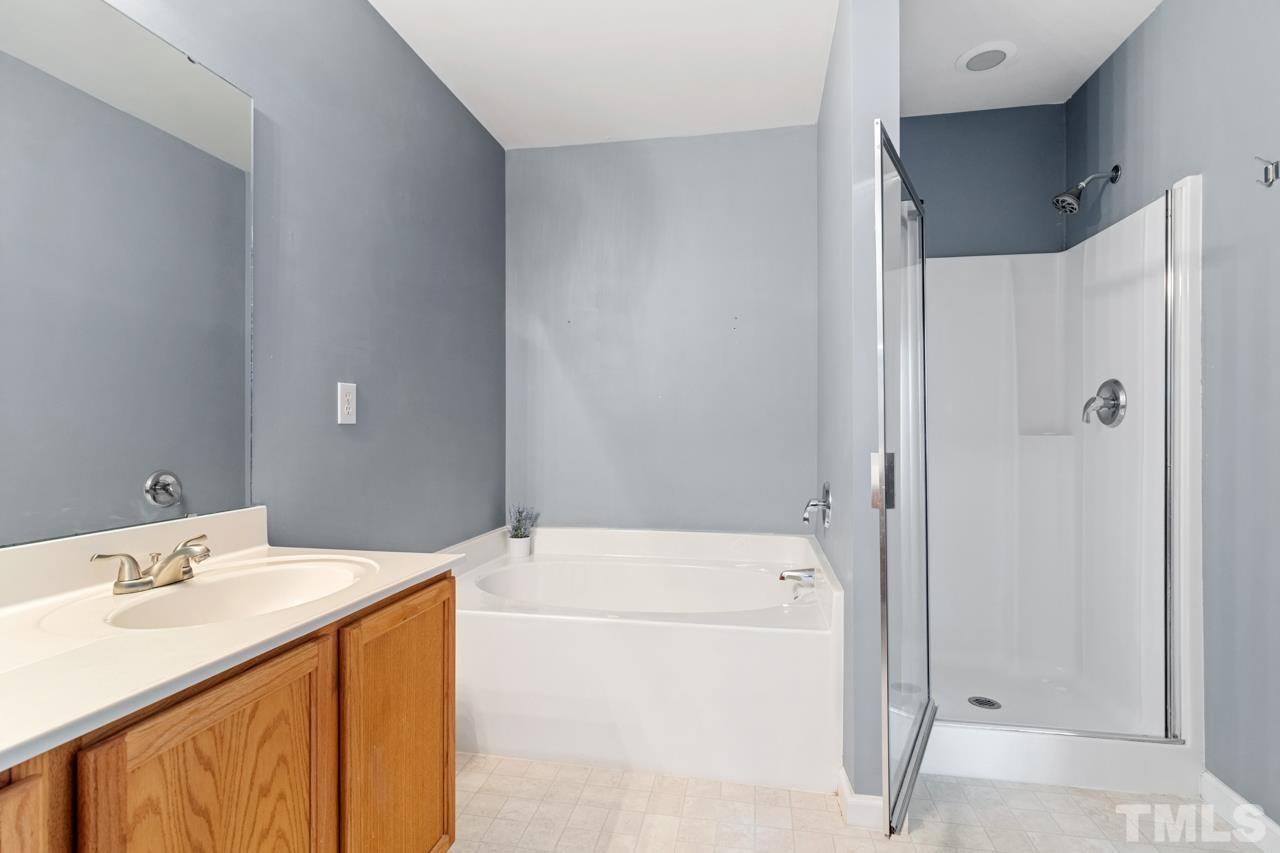 32 Brafferton Court Durham, NC 27713 - Photo 17 of 32 a bathroom with a sink a toilet and shower