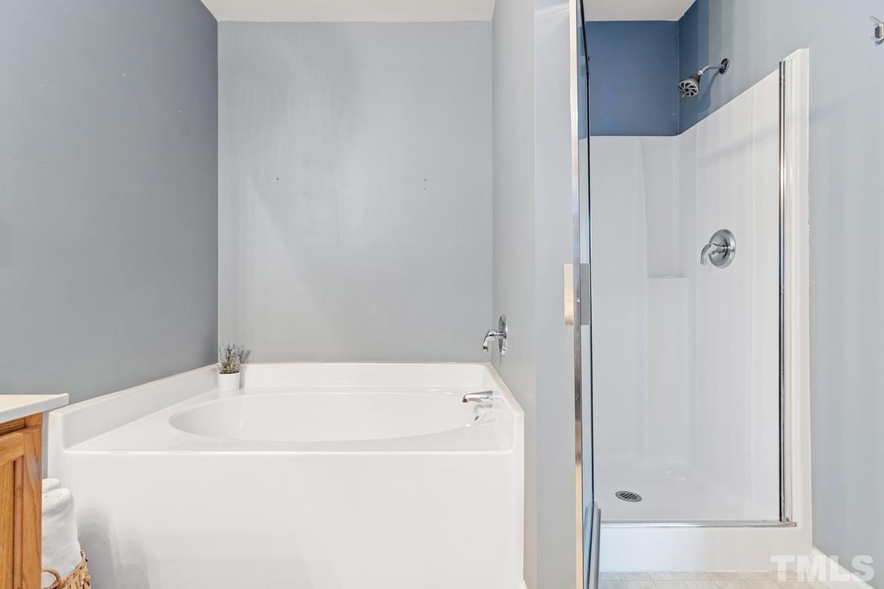 32 Brafferton Court Durham, NC 27713 - Photo 18 of 32 a bathroom with a white bath tub