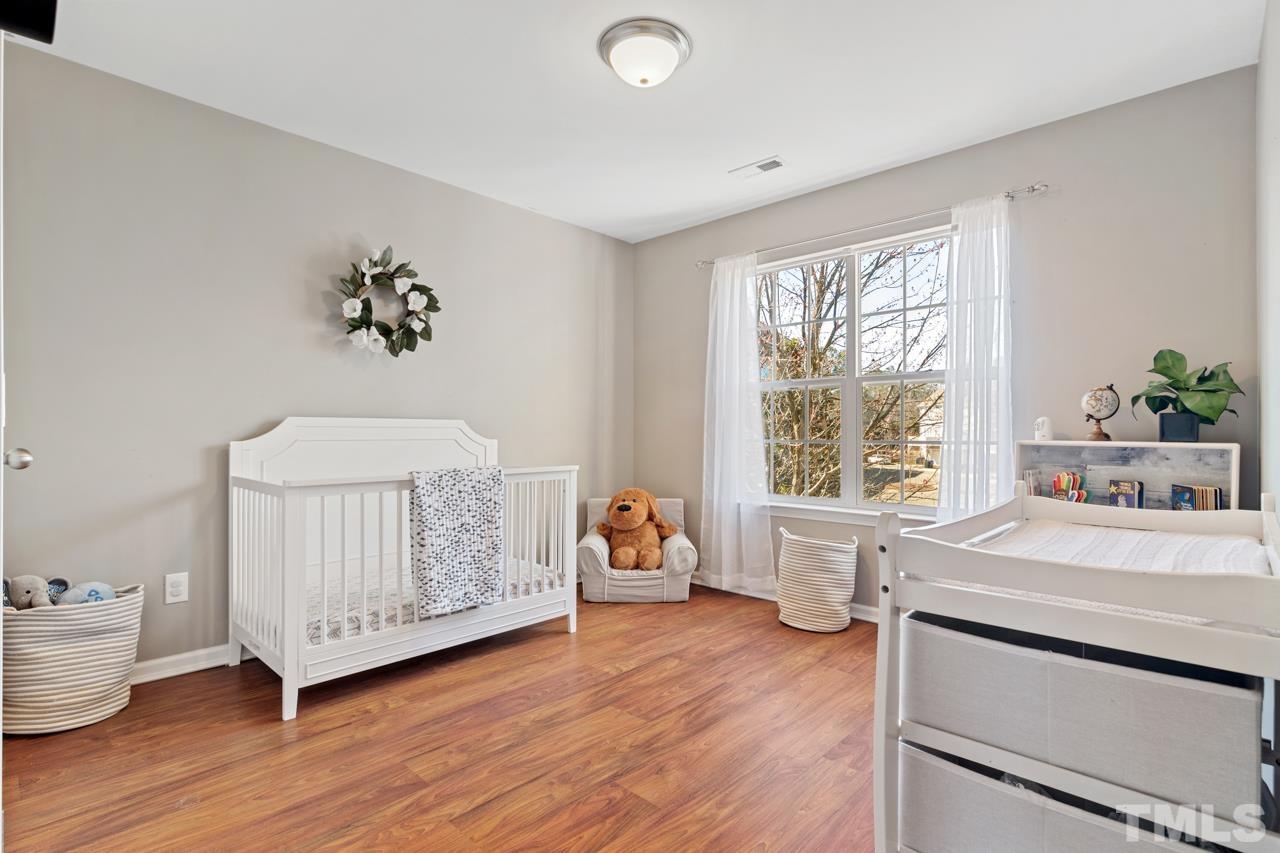 32 Brafferton Court Durham, NC 27713 - Photo 20 of 32 a living room with furniture and a wooden floor