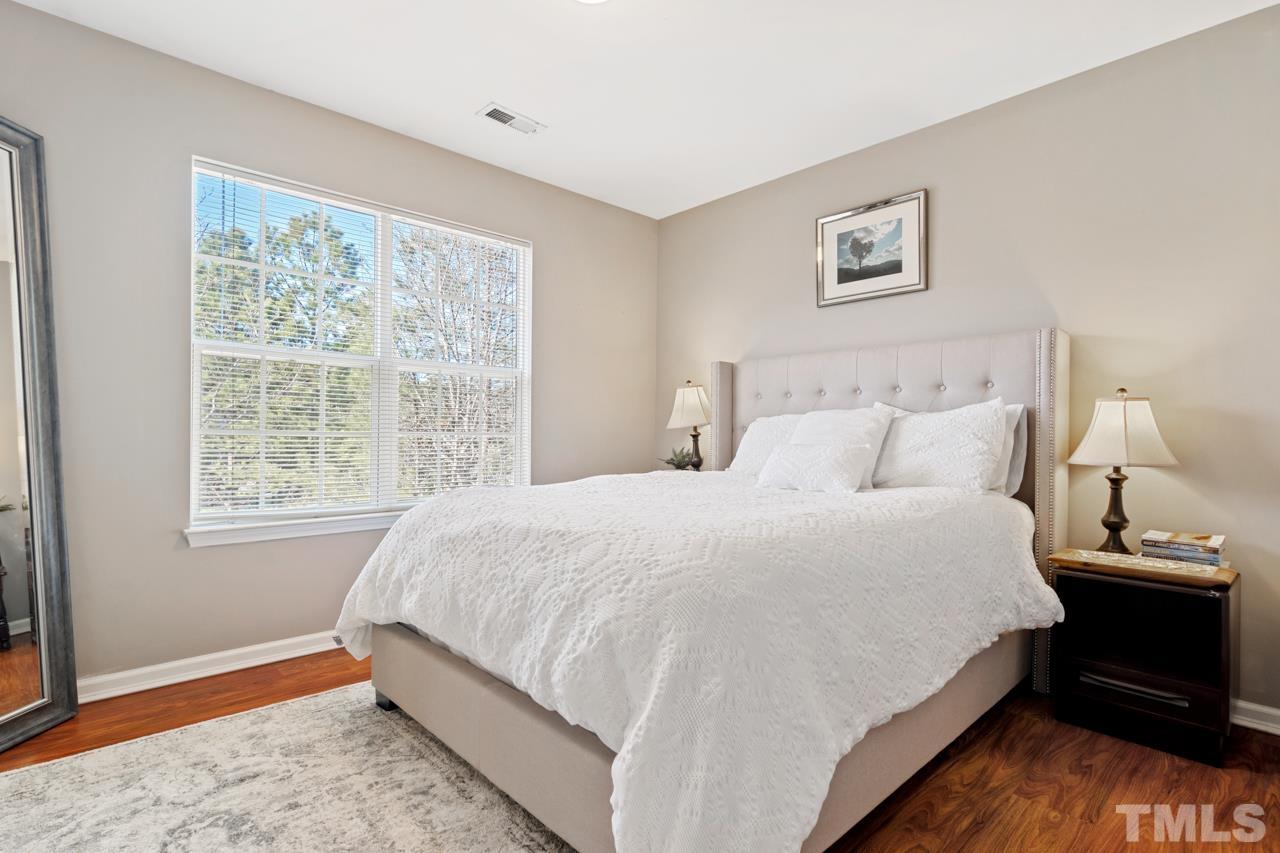32 Brafferton Court Durham, NC 27713 - Photo 23 of 32 a bedroom with a bed and a window