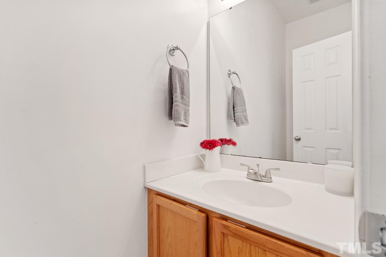 32 Brafferton Court Durham, NC 27713 - Photo 25 of 32 a bathroom with a sink and a mirror