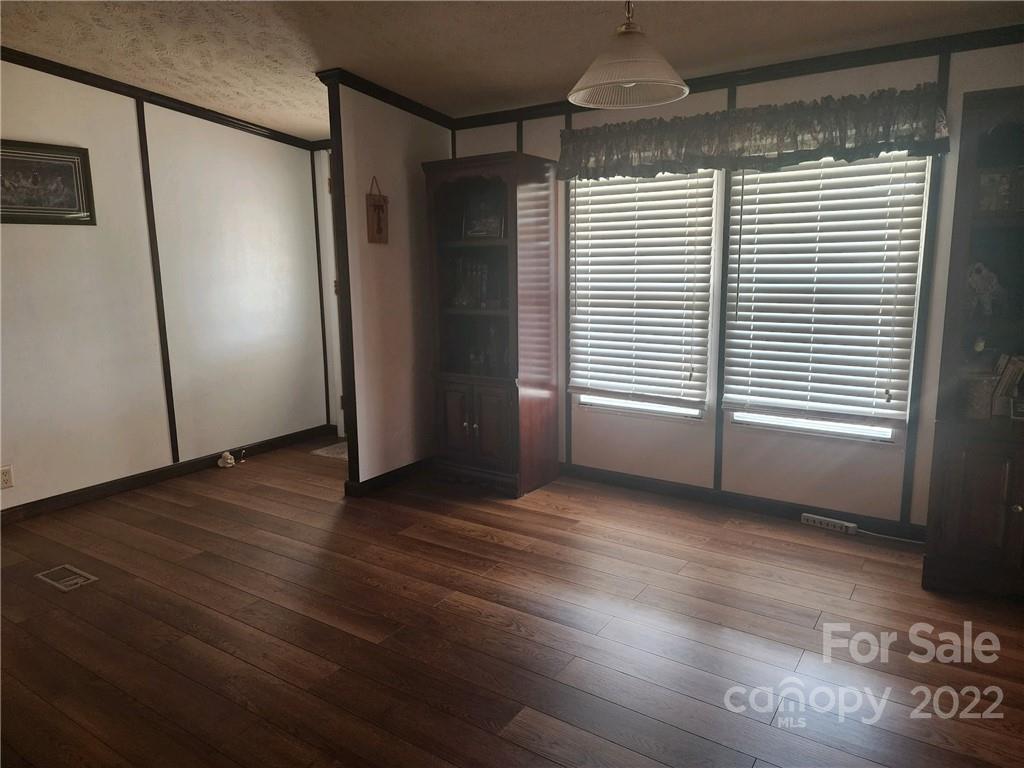 20 Beulah Road Ruby, SC 29741 - Photo 11 of 24 an empty room with wooden floor and windows