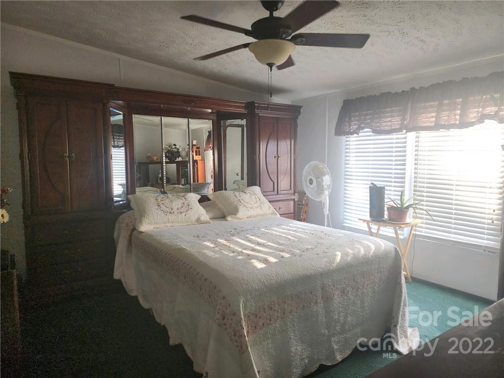 20 Beulah Road Ruby, SC 29741 - Photo 14 of 24 a bed sitting in a spacious bedroom next to a window
