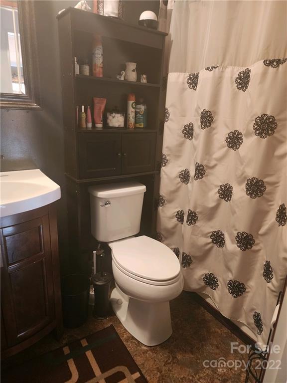 20 Beulah Road Ruby, SC 29741 - Photo 17 of 24 a bathroom with a toilet and a shower curtain