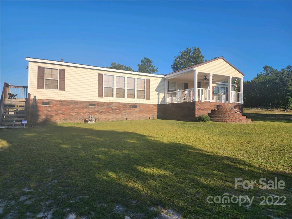 20 Beulah Road Ruby, SC 29741 - Photo 2 of 24 a front view of a house with a garden