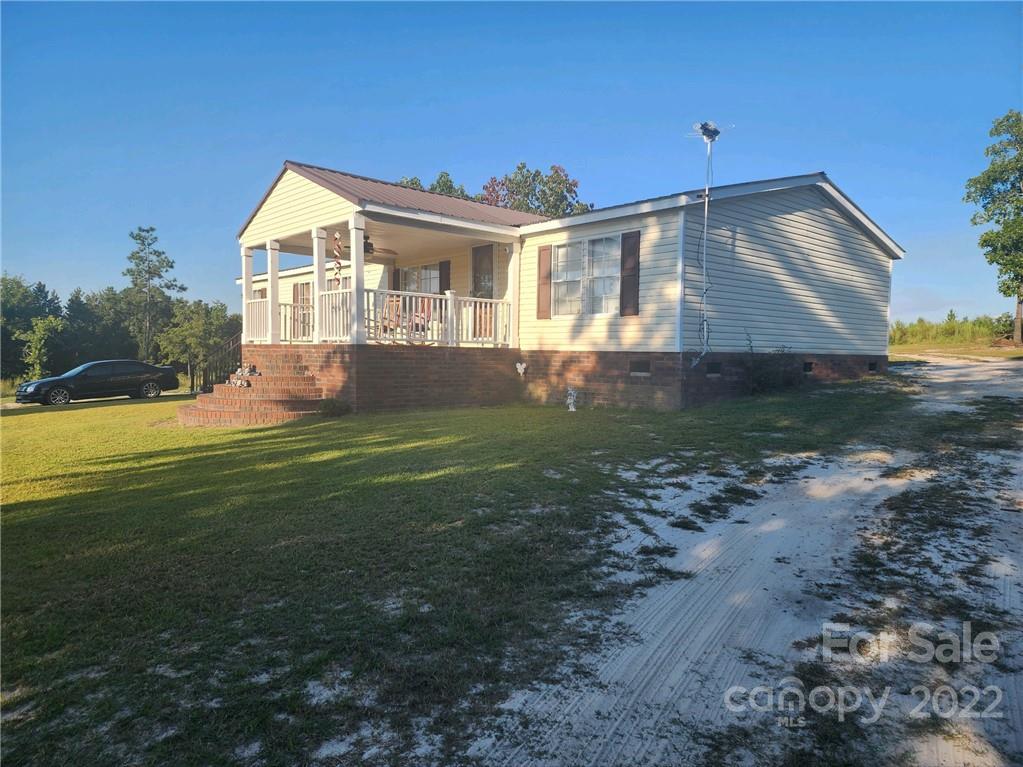 20 Beulah Road Ruby, SC 29741 - Photo 3 of 24 a front view of a house with a yard