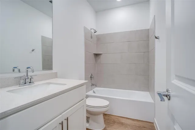 a bathroom with a sink a toilet and a bathtub