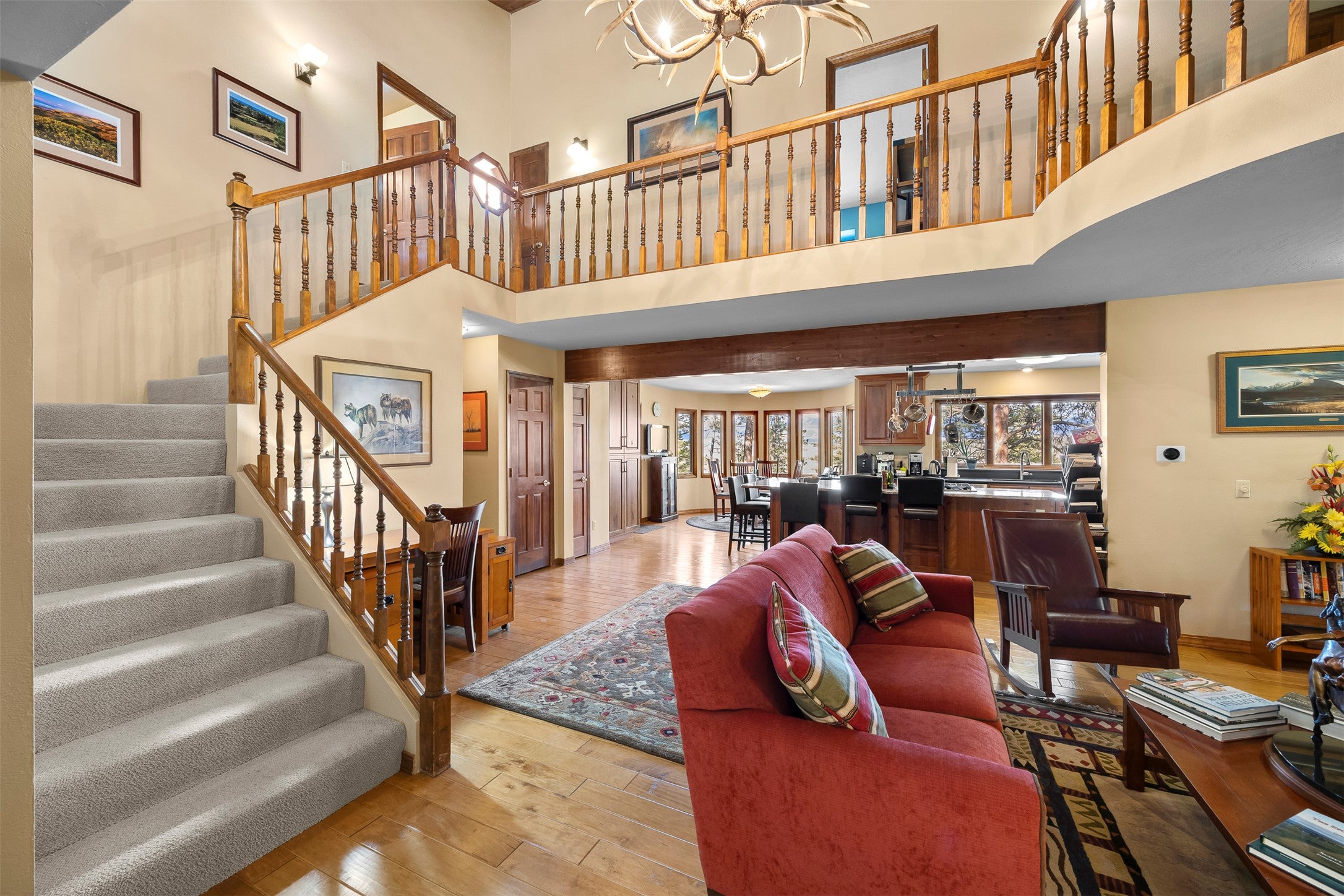 730 Big Flat Road Missoula, MT 59804 - Photo 23 of 59 Living area with hardwood / wood-style floors, hanging lights, and a high ceiling