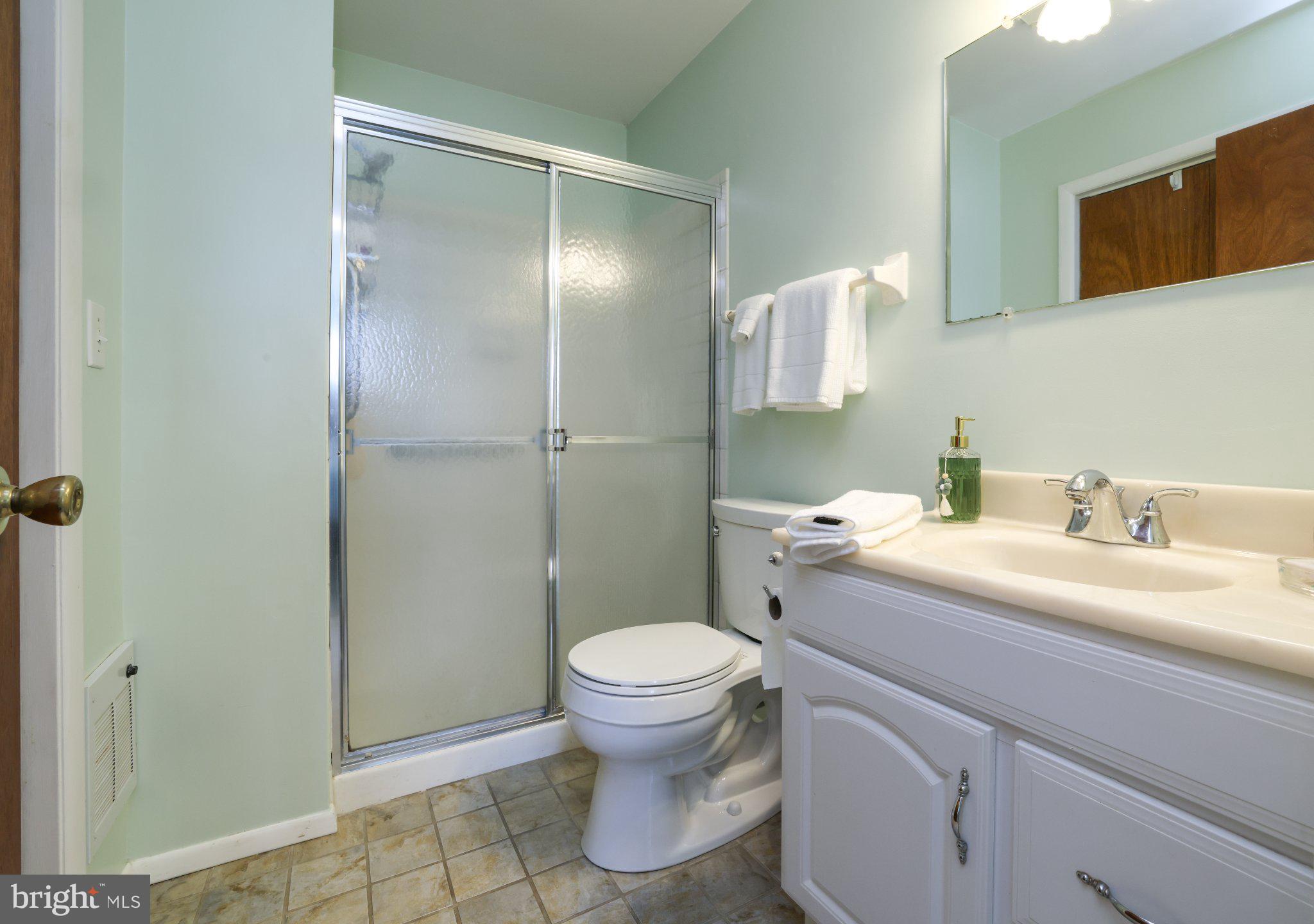 27 Magnolia Road Manahawkin, NJ 08050 - Photo 15 of 26 a bathroom with a granite countertop sink toilet and shower