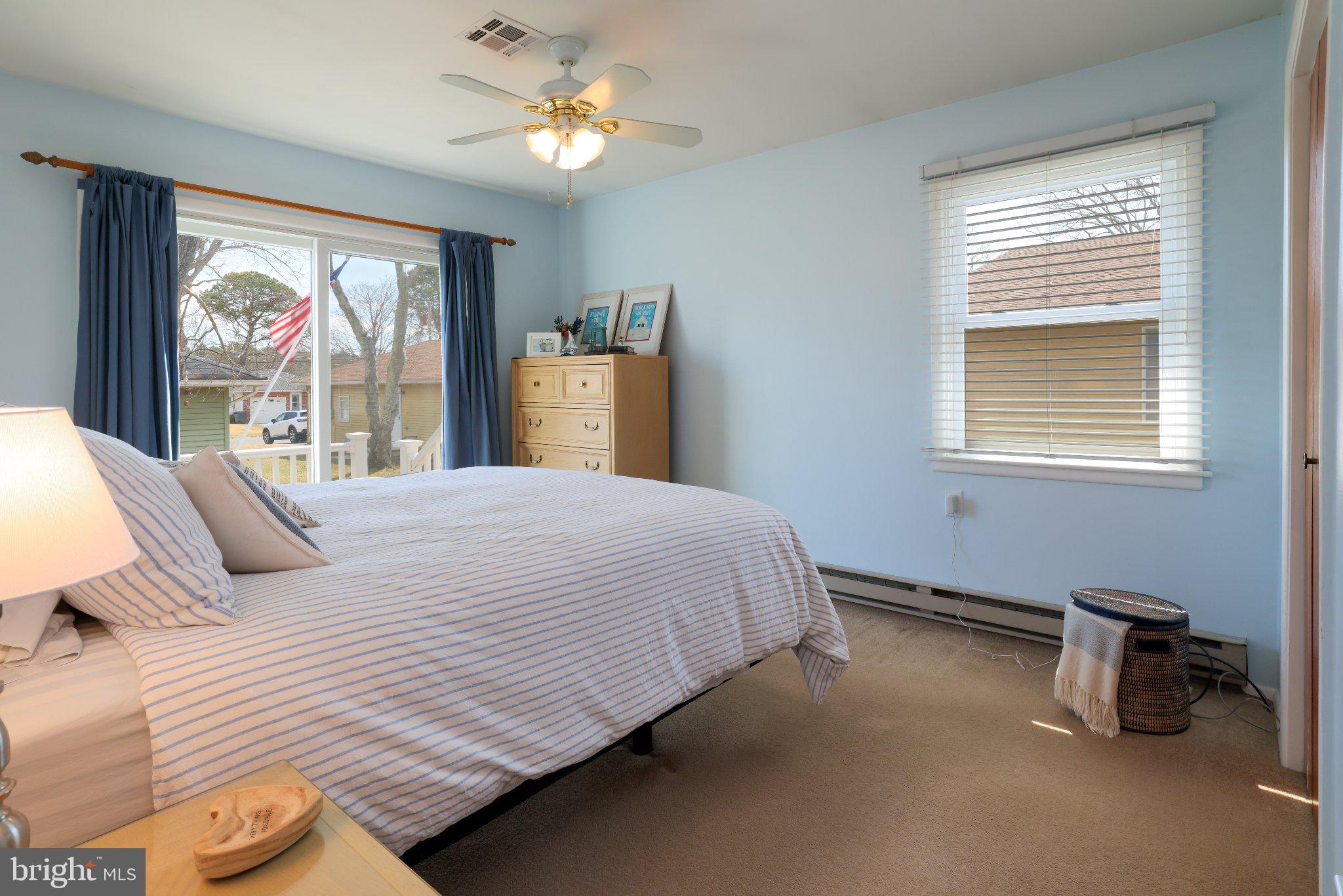 27 Magnolia Road Manahawkin, NJ 08050 - Photo 16 of 26 a bedroom with a large bed and a window