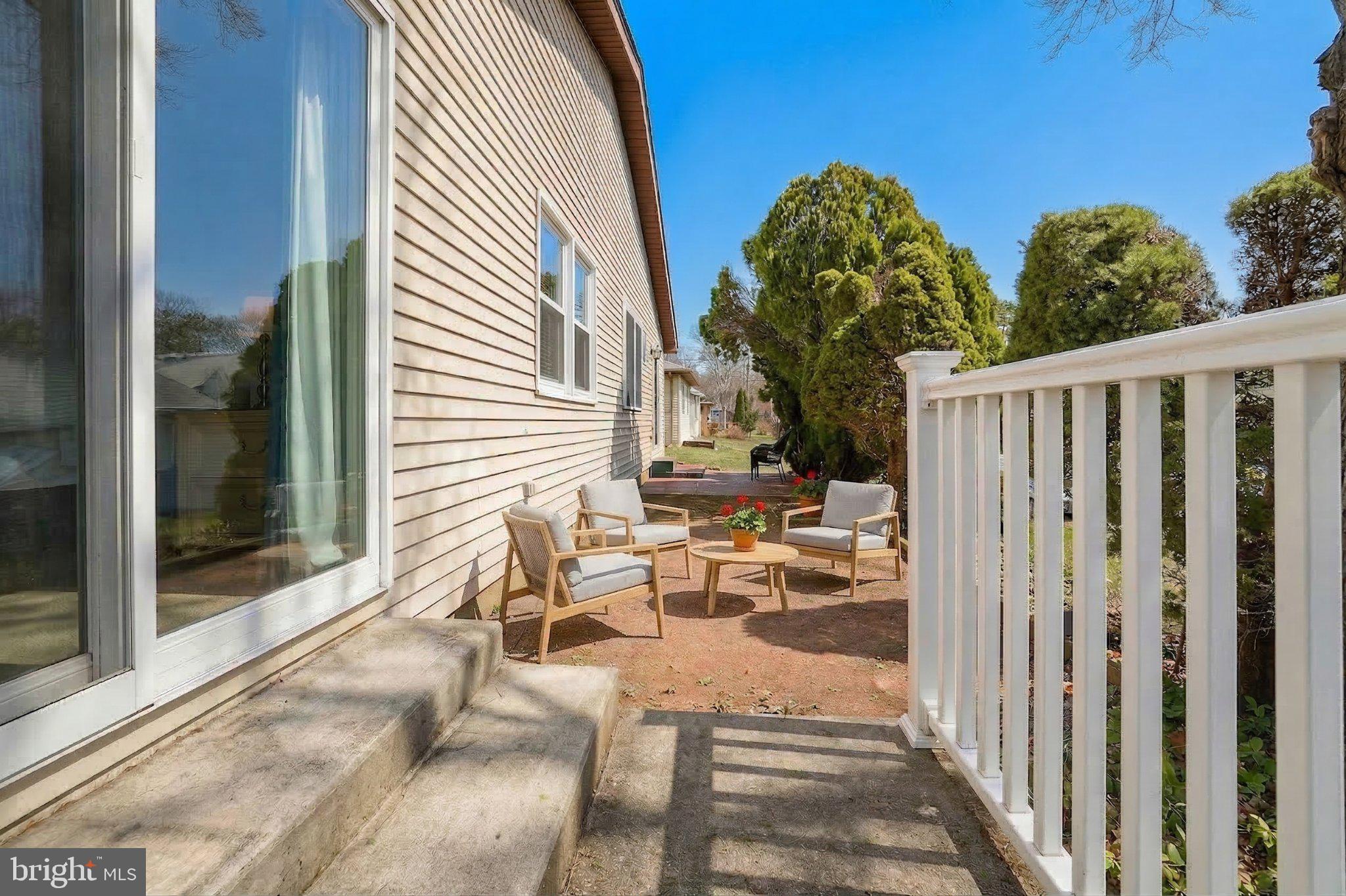 27 Magnolia Road Manahawkin, NJ 08050 - Photo 18 of 26 a view of a porch with a table and chairs