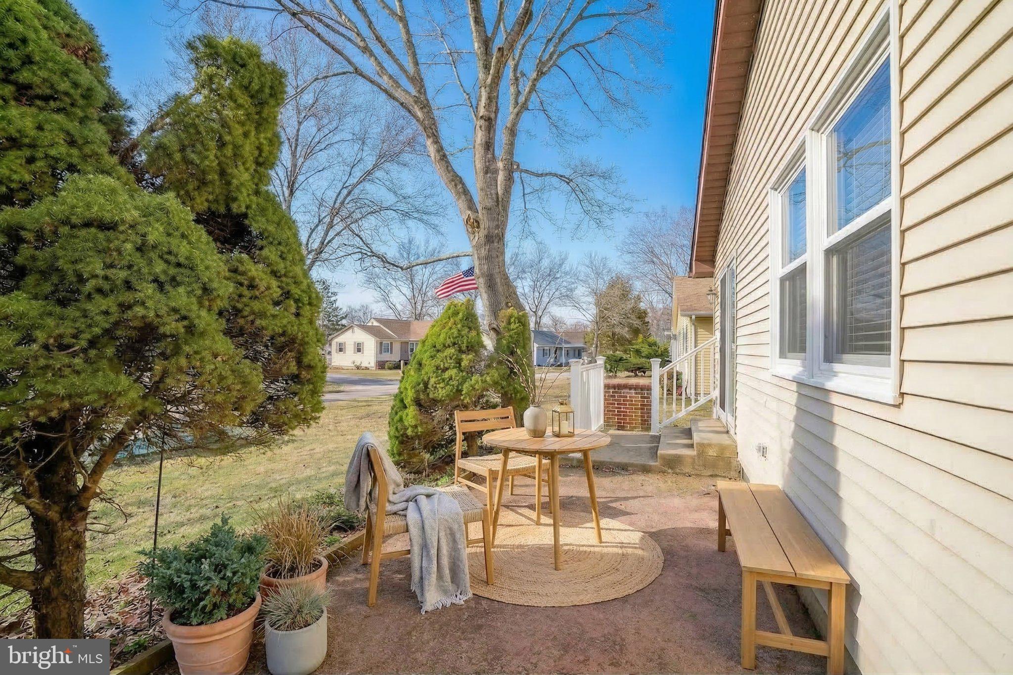 27 Magnolia Road Manahawkin, NJ 08050 - Photo 20 of 26 a building outdoor space with patio furniture and potted plants