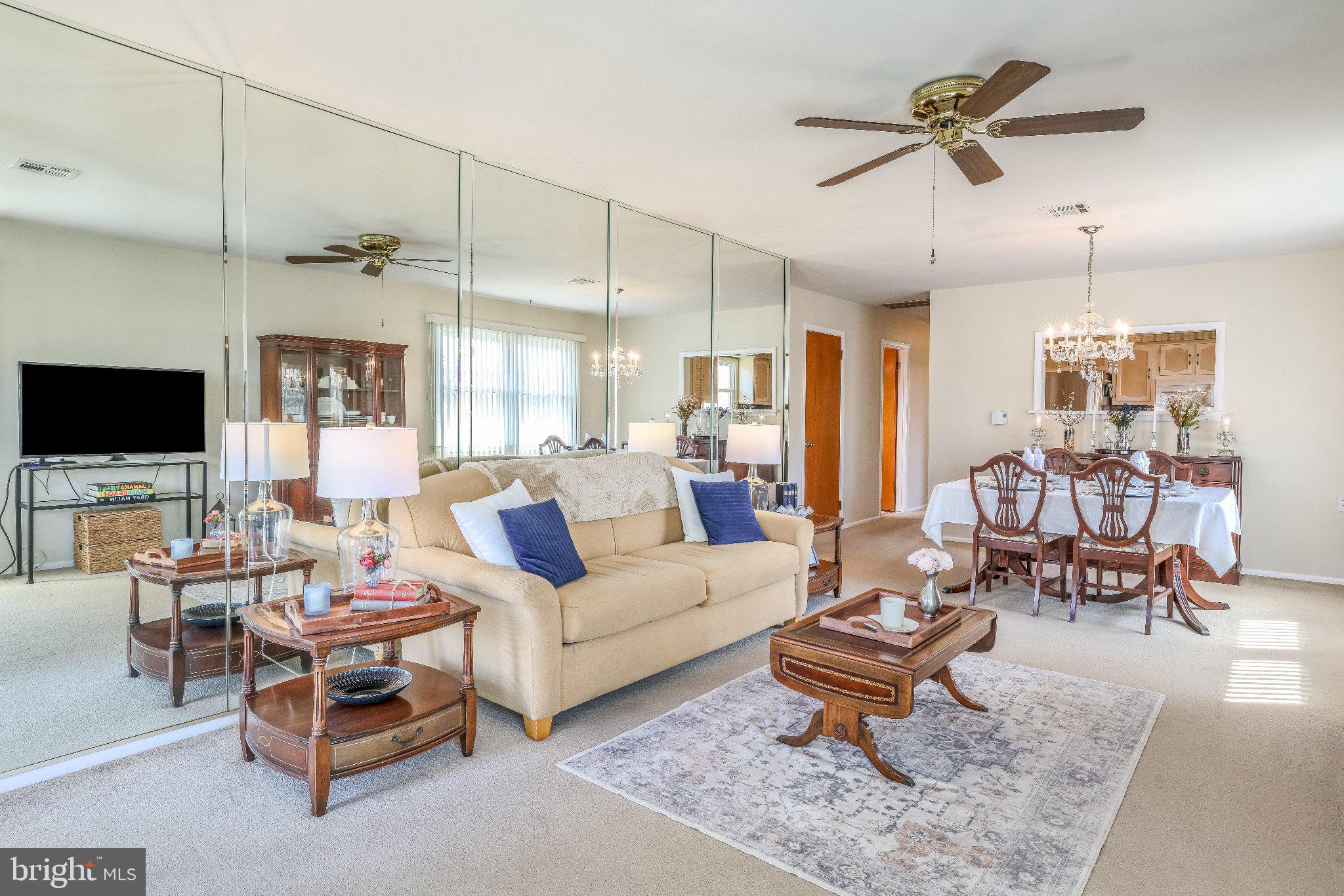 27 Magnolia Road Manahawkin, NJ 08050 - Photo 7 of 26 a living room with furniture a rug and a flat screen tv
