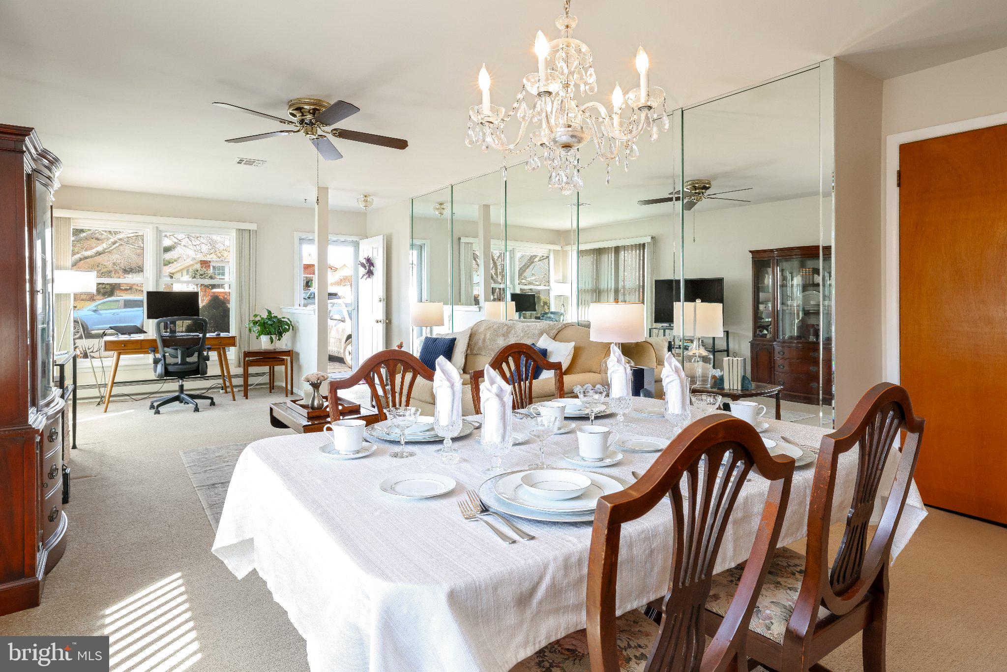 27 Magnolia Road Manahawkin, NJ 08050 - Photo 8 of 26 a dining room with furniture a chandelier and wooden floor