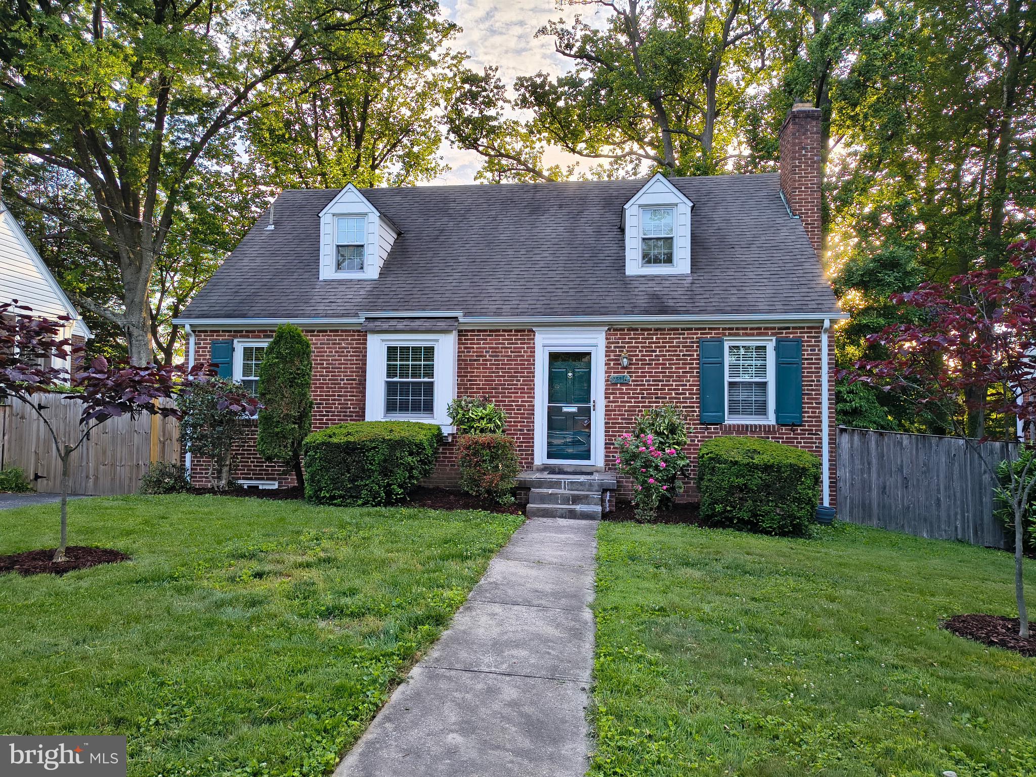 9316 Sudbury Road Silver Spring, MD 20901 - Photo 18 of 19 a front view of a house with a yard