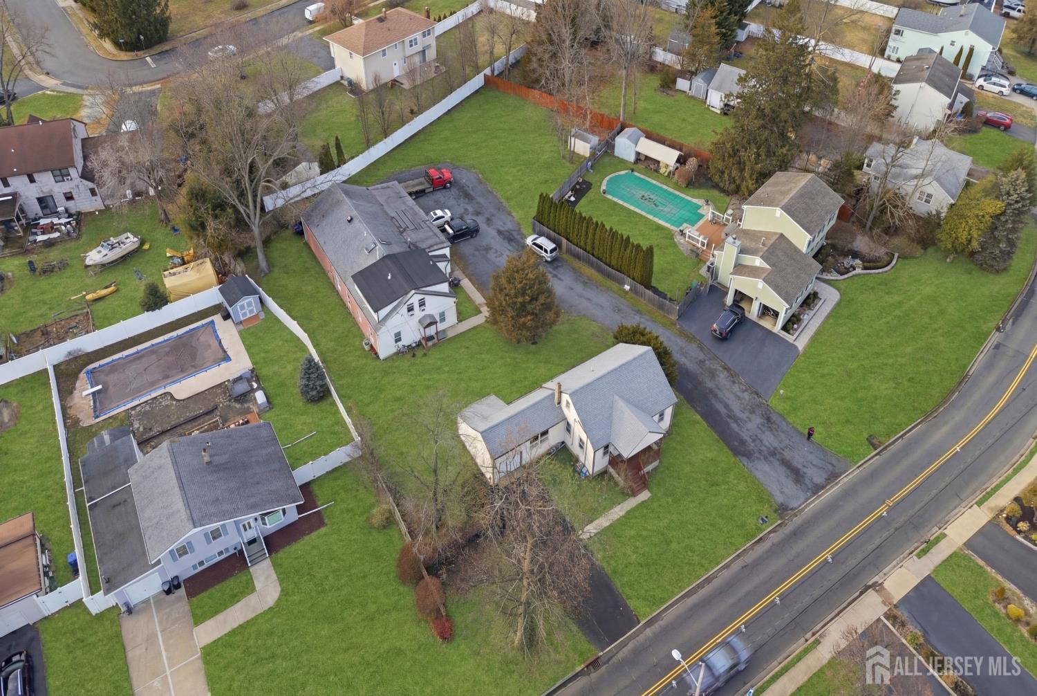 49 B Middlesex Road Old Bridge, NJ 07747 - Photo 12 of 14 an aerial view of a house with a garden and trees