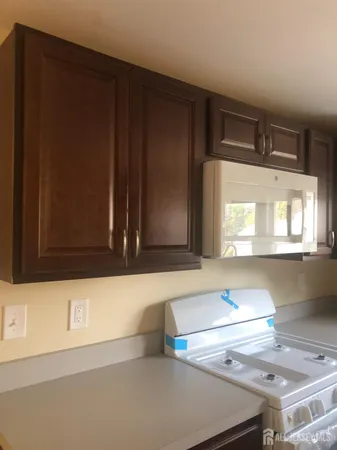 a view of a kitchen with windows