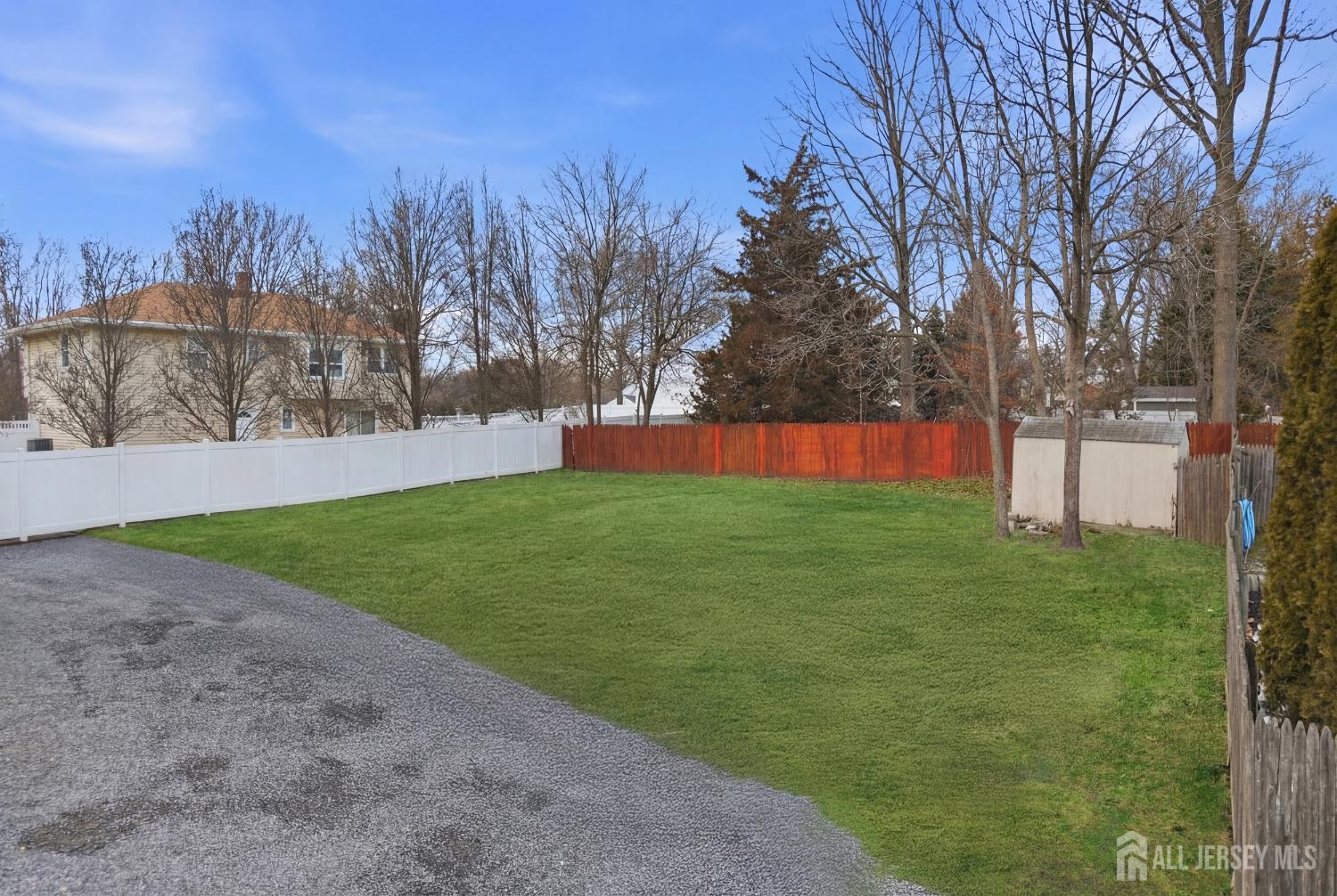 49 B Middlesex Road Old Bridge, NJ 07747 - Photo 8 of 14 a view of yard with tree in the background