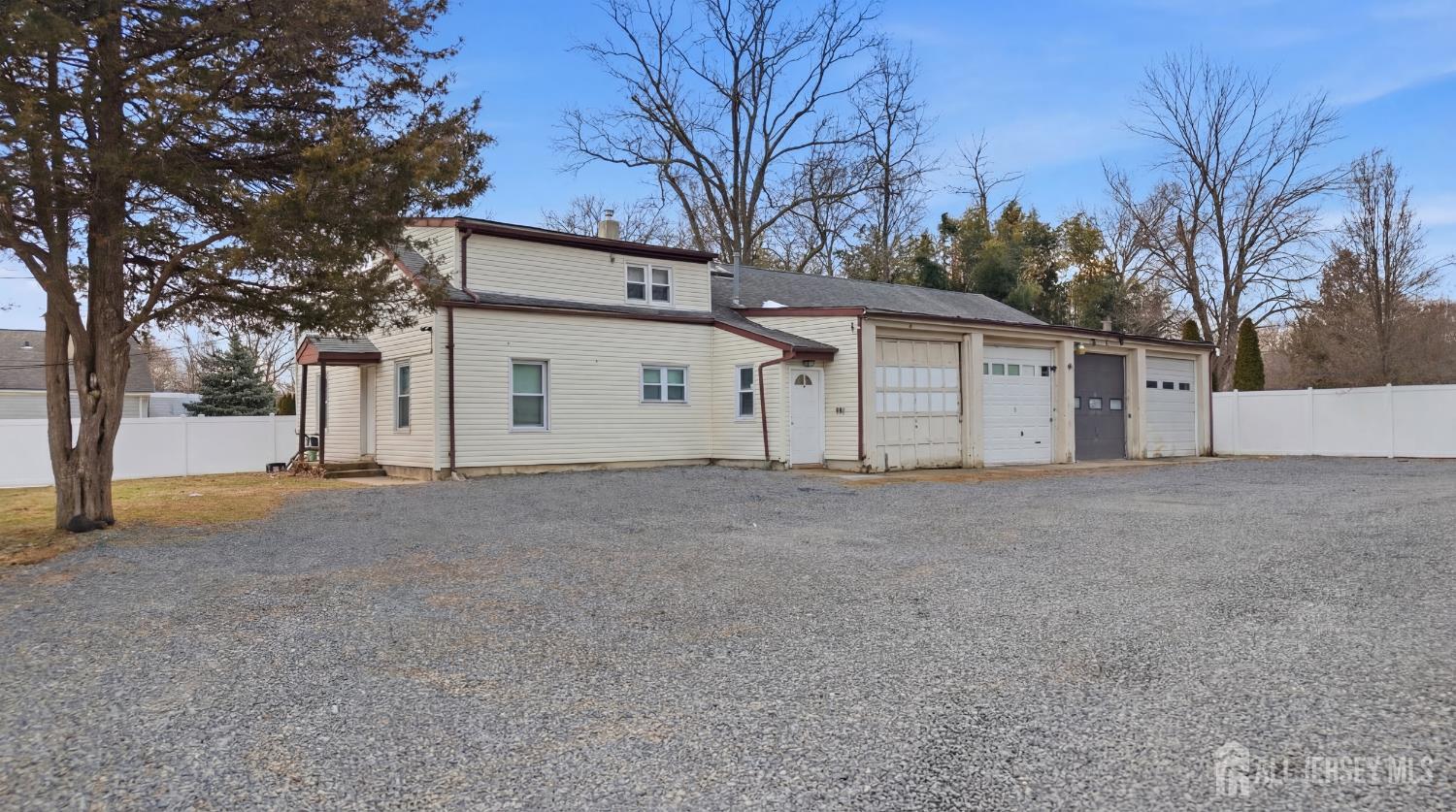 49 B Middlesex Road Old Bridge, NJ 07747 - Photo 9 of 14 a view of a house with a yard and garage