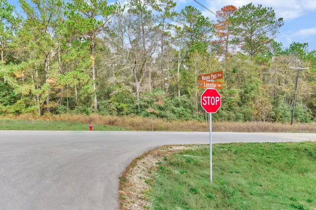 a sign board with an trees