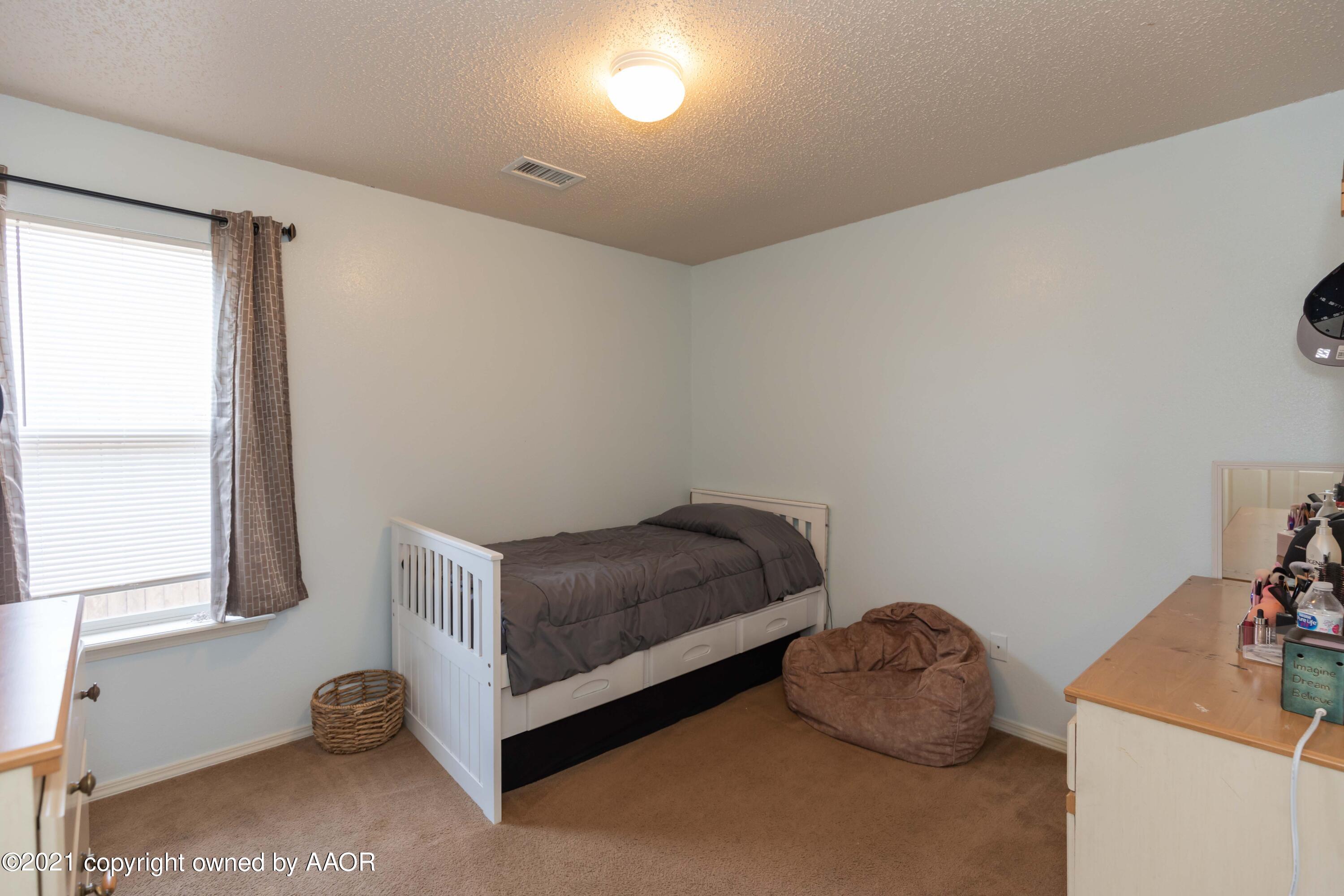 1025 Ketler Street Amarillo, TX 79104 - Photo 25 of 31 a living room with furniture and a window
