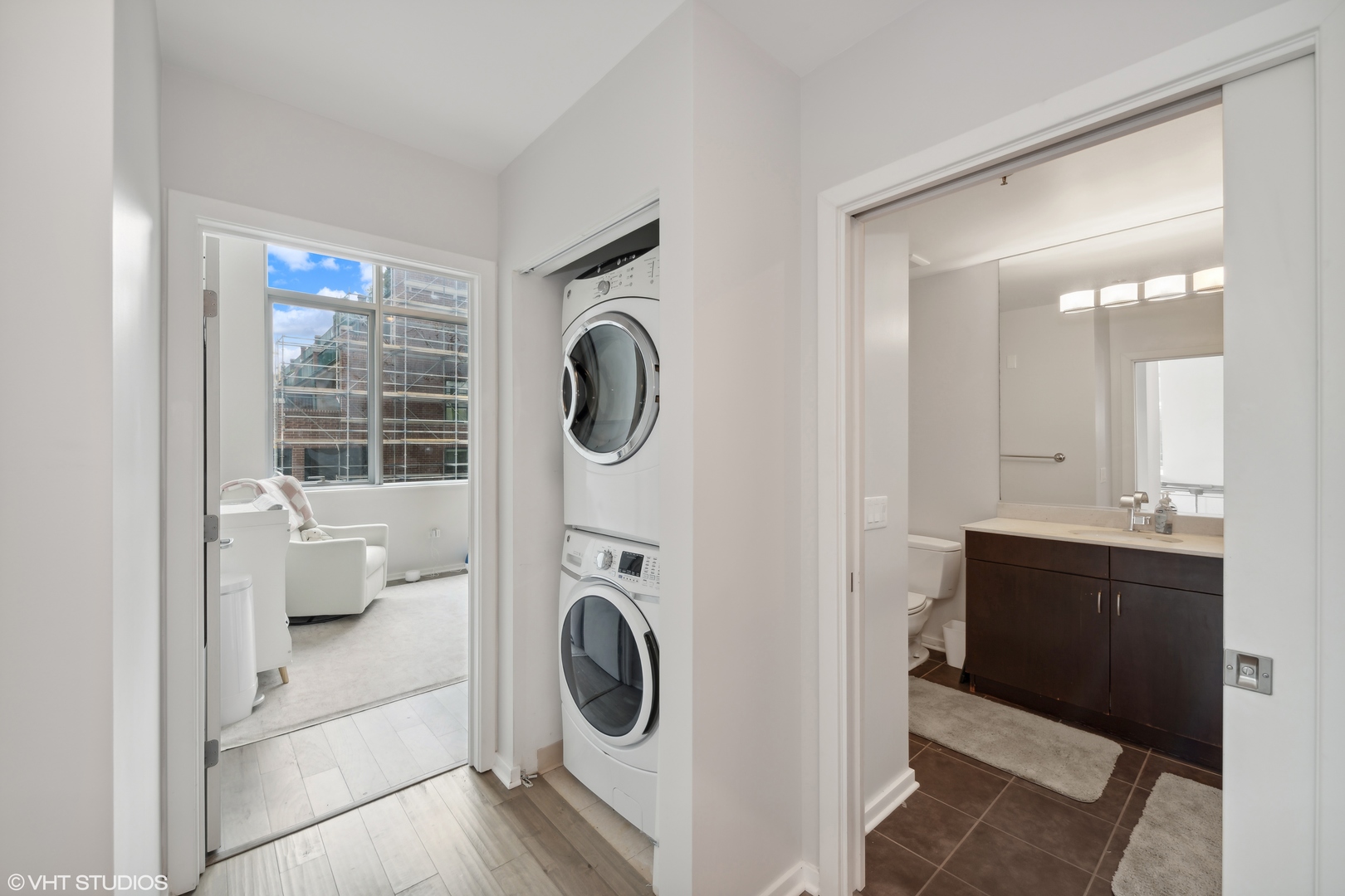 123 South Green Street, Unit 208B Chicago, IL 60607 - Photo 11 of 17 a view of a bathroom with washing machine and dryer
