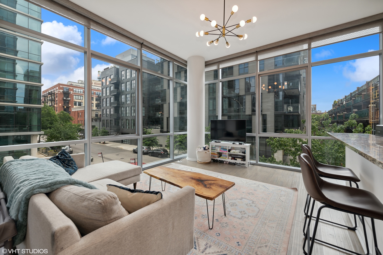 123 South Green Street, Unit 208B Chicago, IL 60607 - Photo 2 of 17 a living room with furniture and a large window