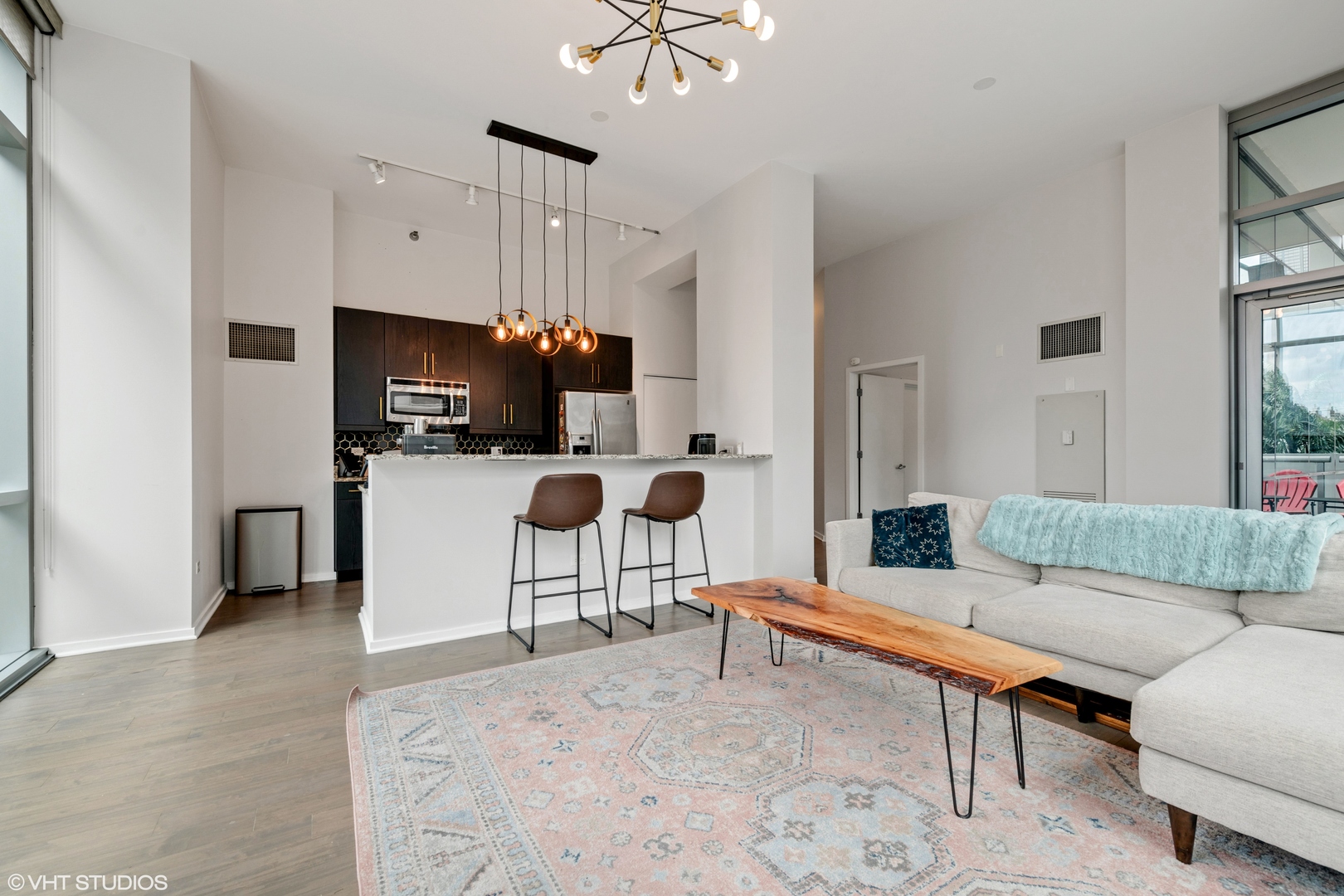 123 South Green Street, Unit 208B Chicago, IL 60607 - Photo 3 of 17 a living room with furniture and a flat screen tv