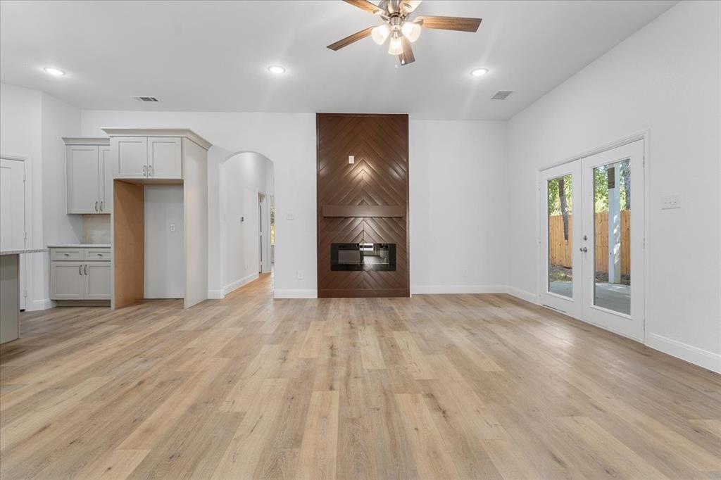 4715 Ramey Avenue Fort Worth, TX 76105 - Photo 11 of 32 wooden floor in an empty room with a window