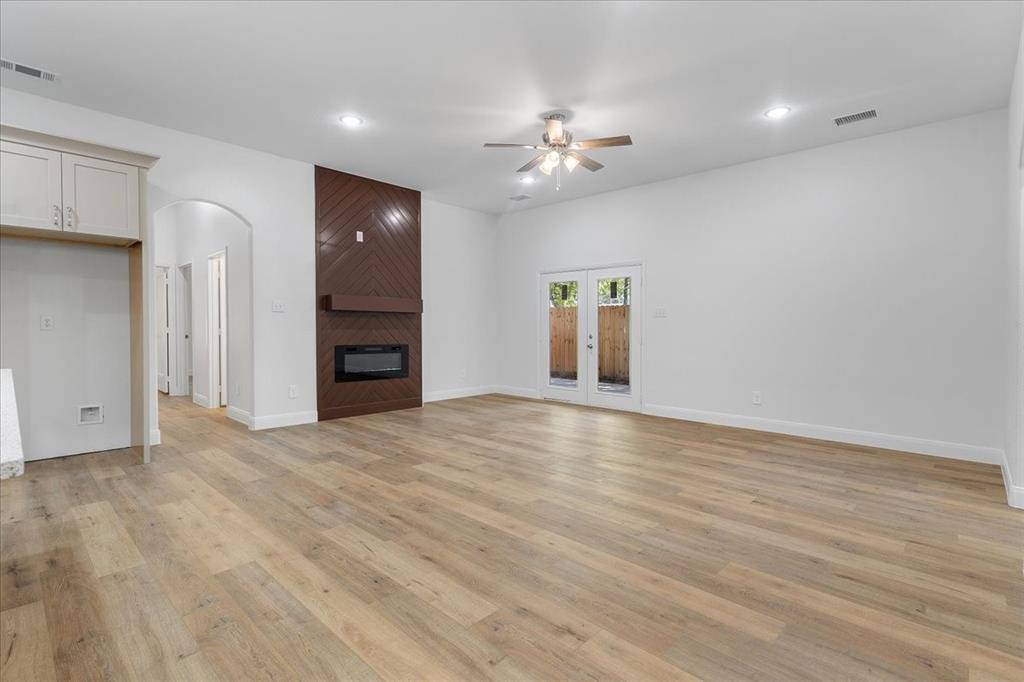 4715 Ramey Avenue Fort Worth, TX 76105 - Photo 12 of 32 a view of an empty room with wooden floor and cabinet