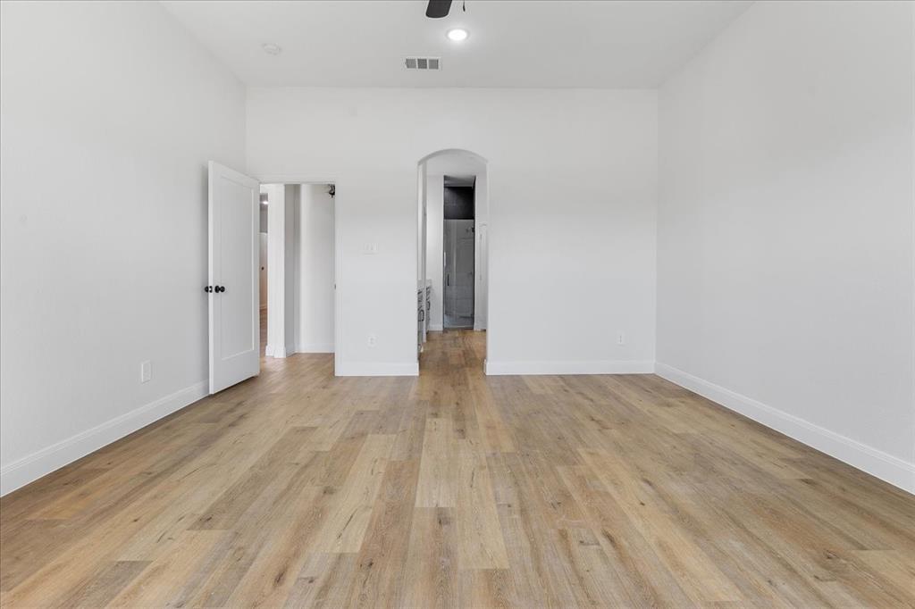 4715 Ramey Avenue Fort Worth, TX 76105 - Photo 15 of 32 a view of empty room with wooden floor
