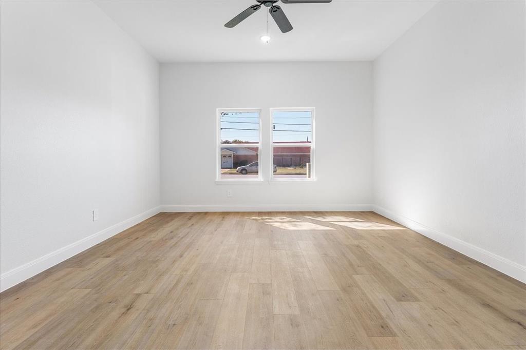 4715 Ramey Avenue Fort Worth, TX 76105 - Photo 16 of 32 an empty room with a empty space and windows