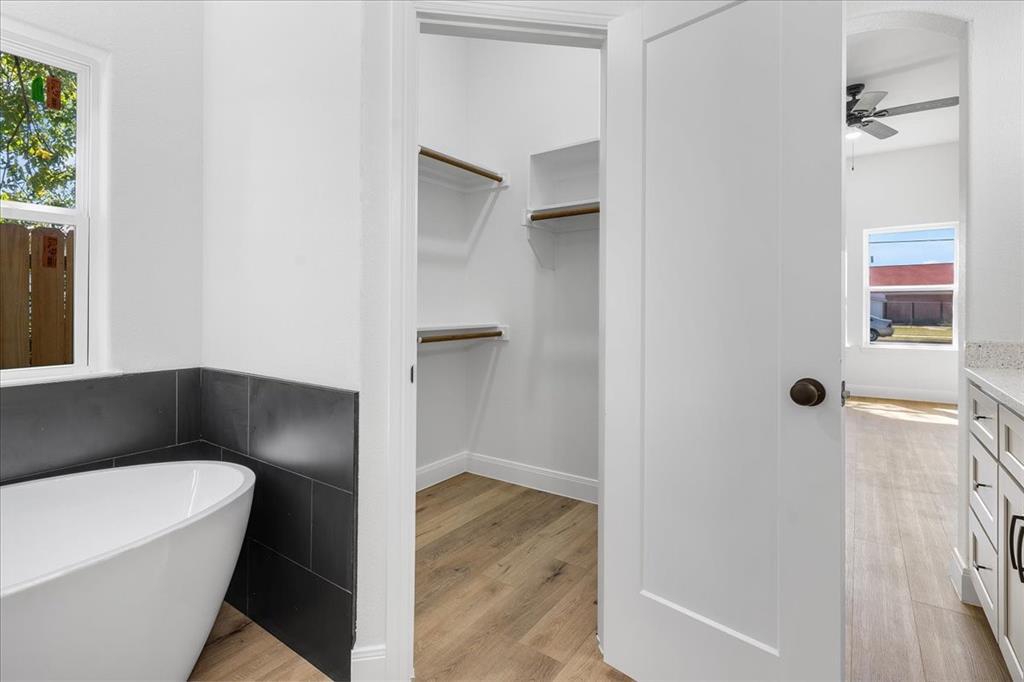 4715 Ramey Avenue Fort Worth, TX 76105 - Photo 19 of 32 a bathroom with a bathtub and a shower