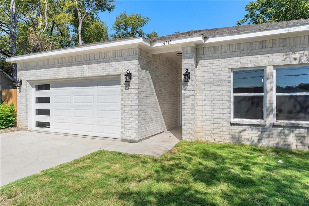 4715 Ramey Avenue Fort Worth, TX 76105 - Photo 2 of 32 a view of a house with a yard and garage