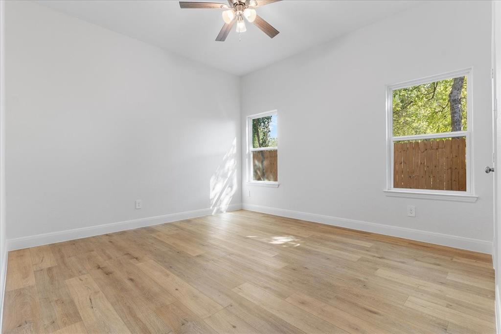 4715 Ramey Avenue Fort Worth, TX 76105 - Photo 27 of 32 wooden floor in an empty room with a window