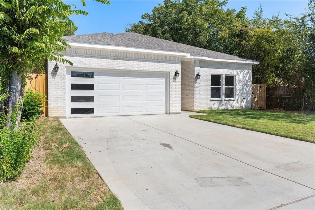 4715 Ramey Avenue Fort Worth, TX 76105 - Photo 4 of 32 a front view of a house with a yard and garage