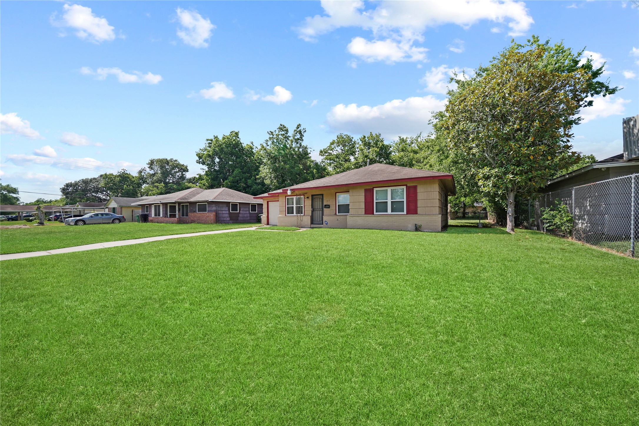 5631 Groveton Street Houston, TX 77033 - Photo 1 of 13 a house view with a garden space